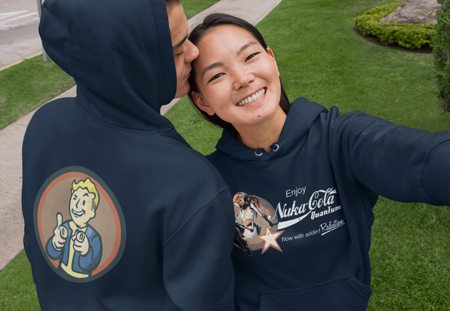 Nuka Cola Nuka Girl Vintage Pin up on the front with Nuka Boy Finger Guns on the back Unisex Hoodie